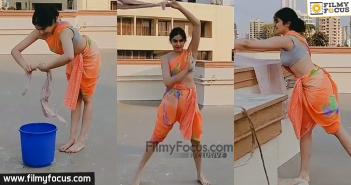 Adah Sharma seen washing clothes on roof1